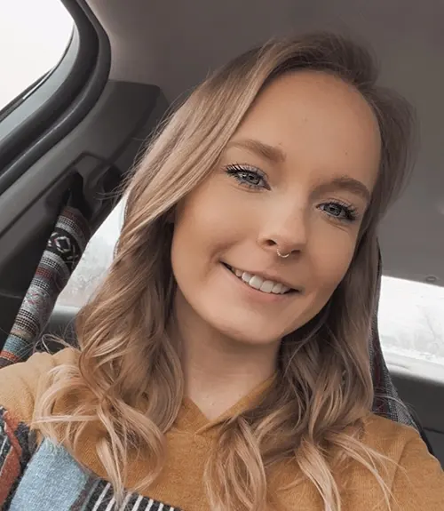 Brandy Carlson smiling, she has blonde hair.